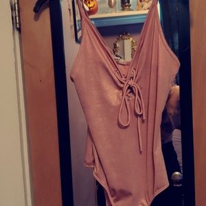 Shimmery pink body suit